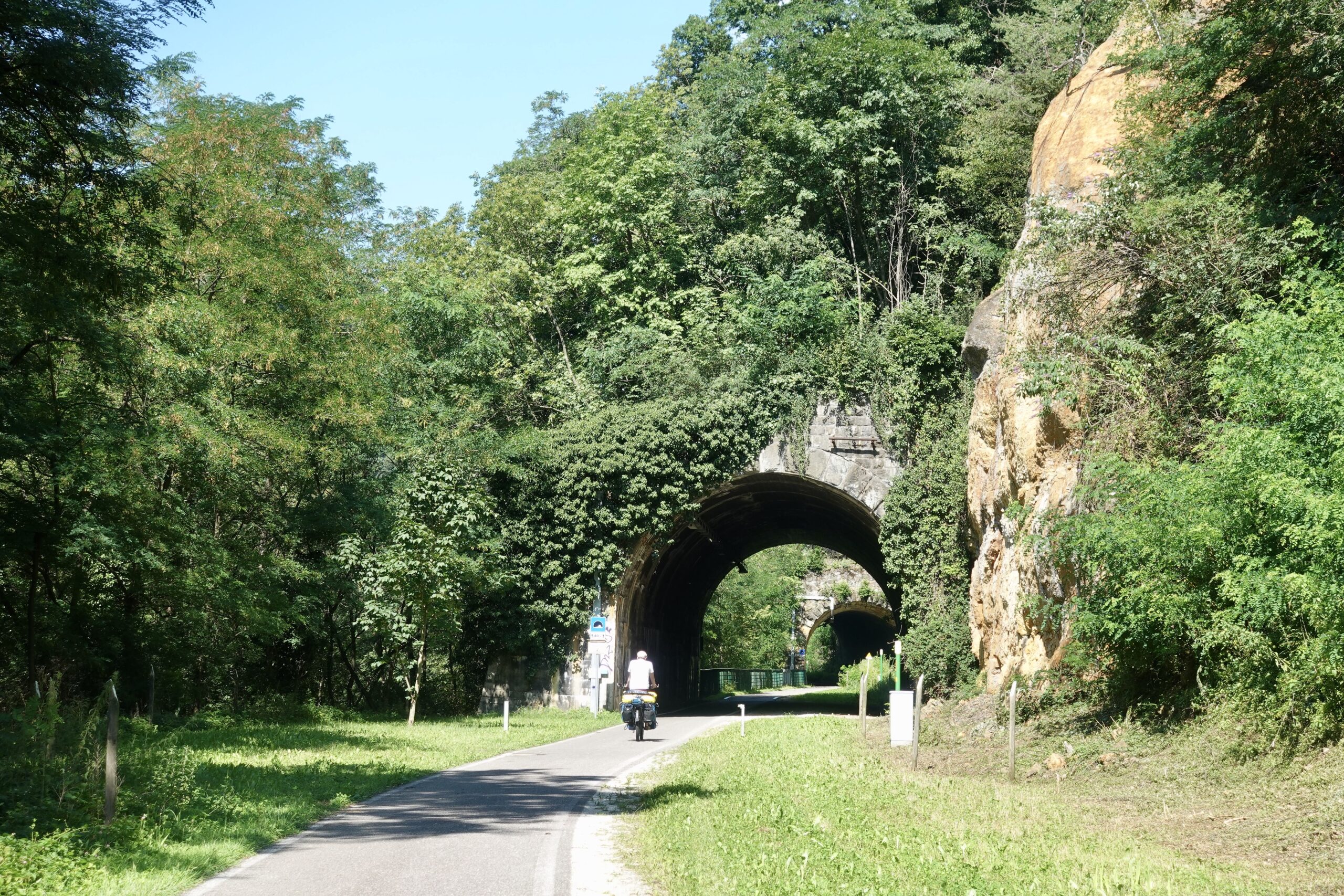 The tunnels on the former railroad cycle path provide welcome cooling