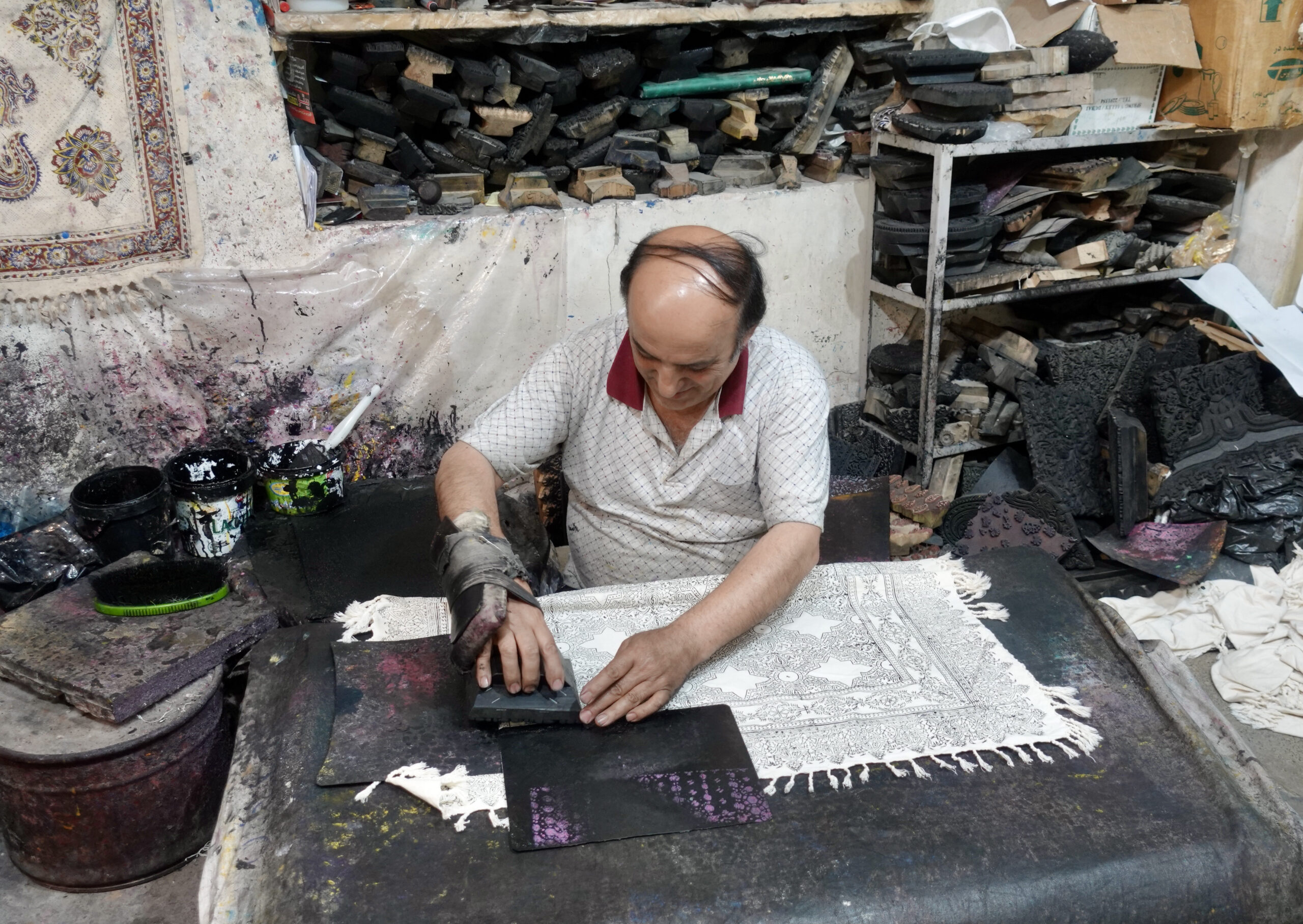 The fabrics are printed by hand with big wooden stamps