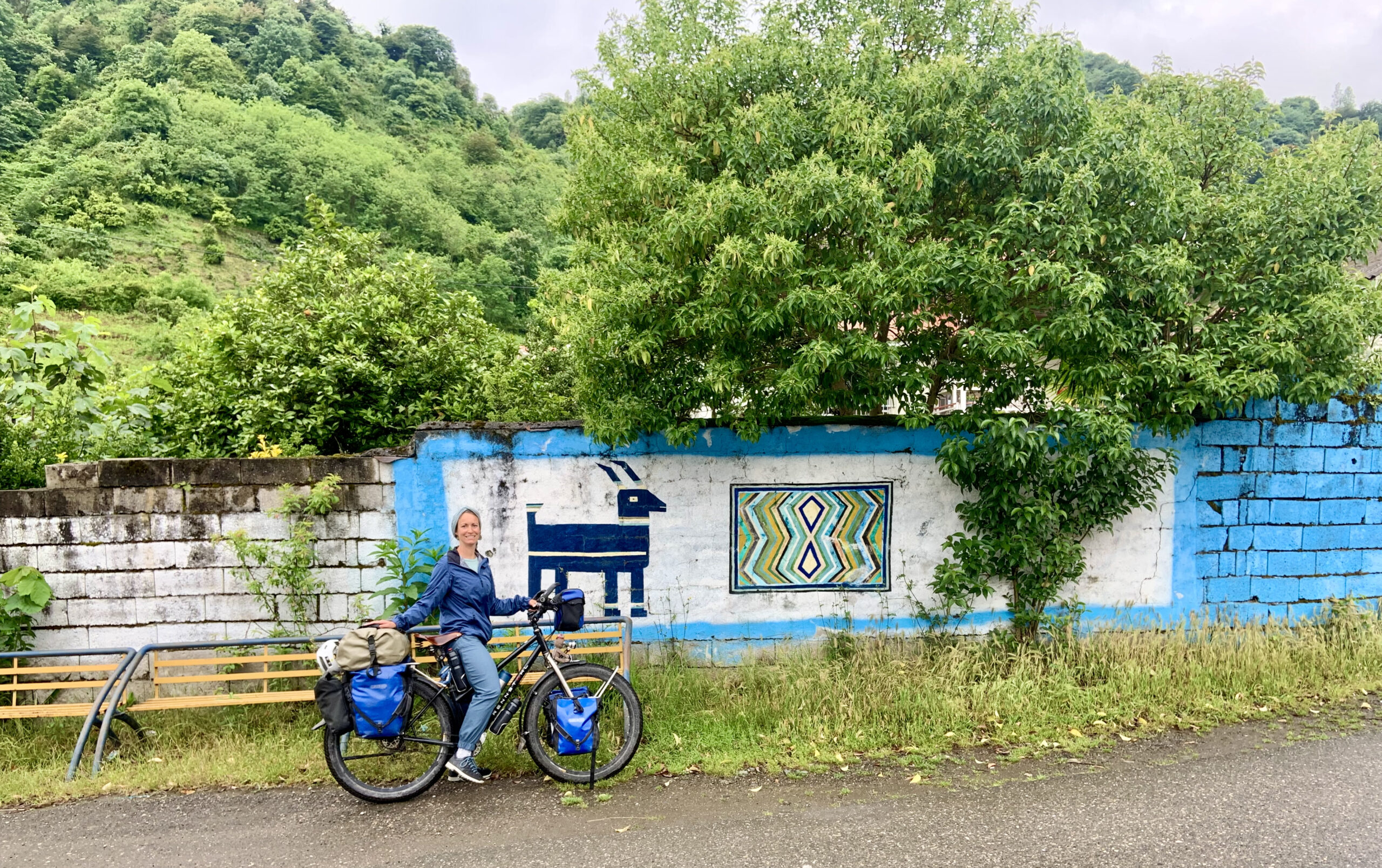 Murals around the villages show the typical symbols used for carpet-weaving