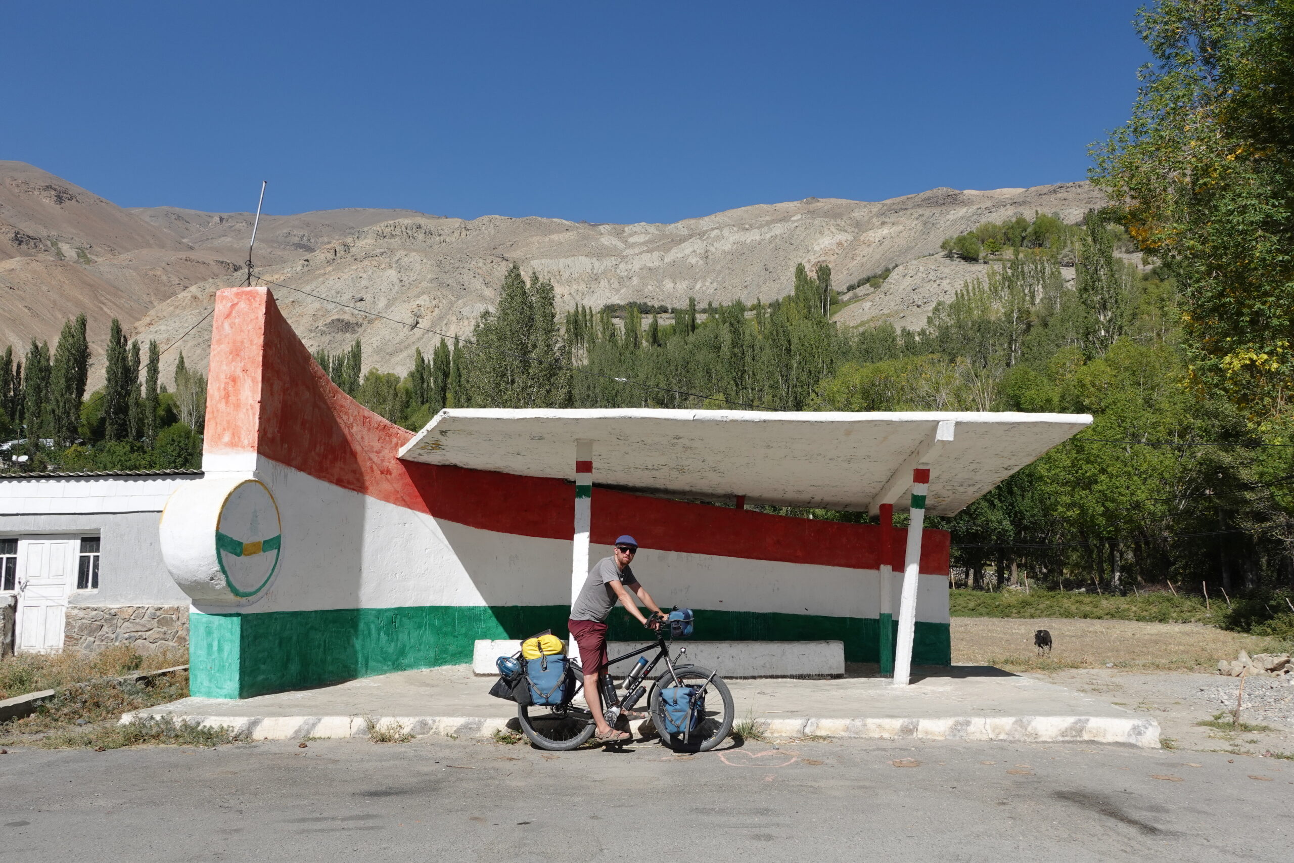 Soviet bus stop painted over with Tajik flag