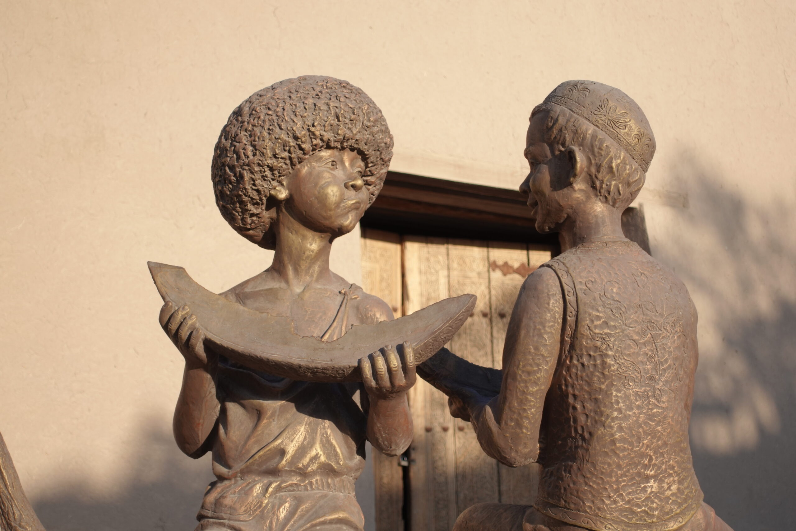 This statue with melons and thick fur hat can stand so only in Uzbekistan