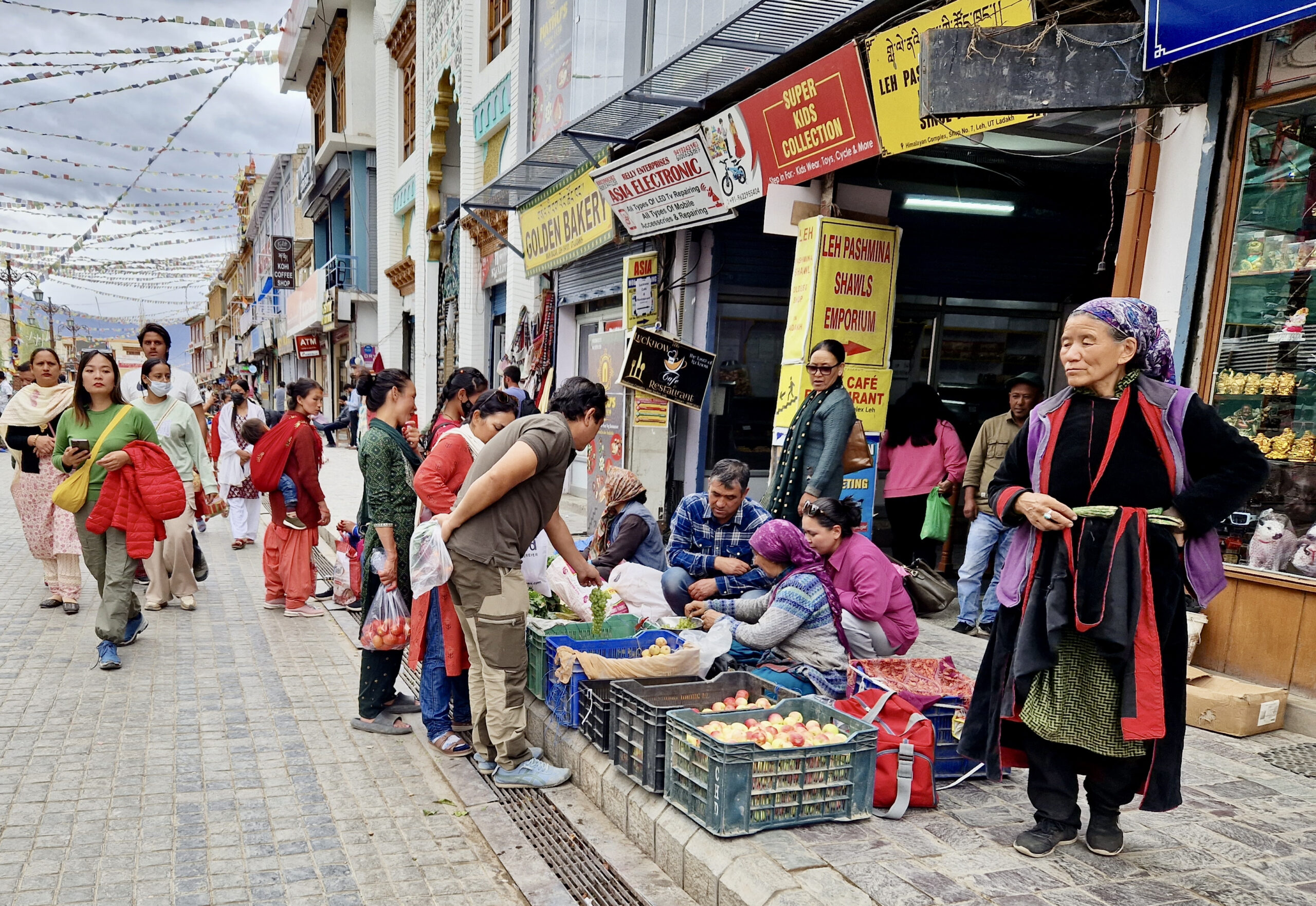 Women from the villages sell fruit in Leh